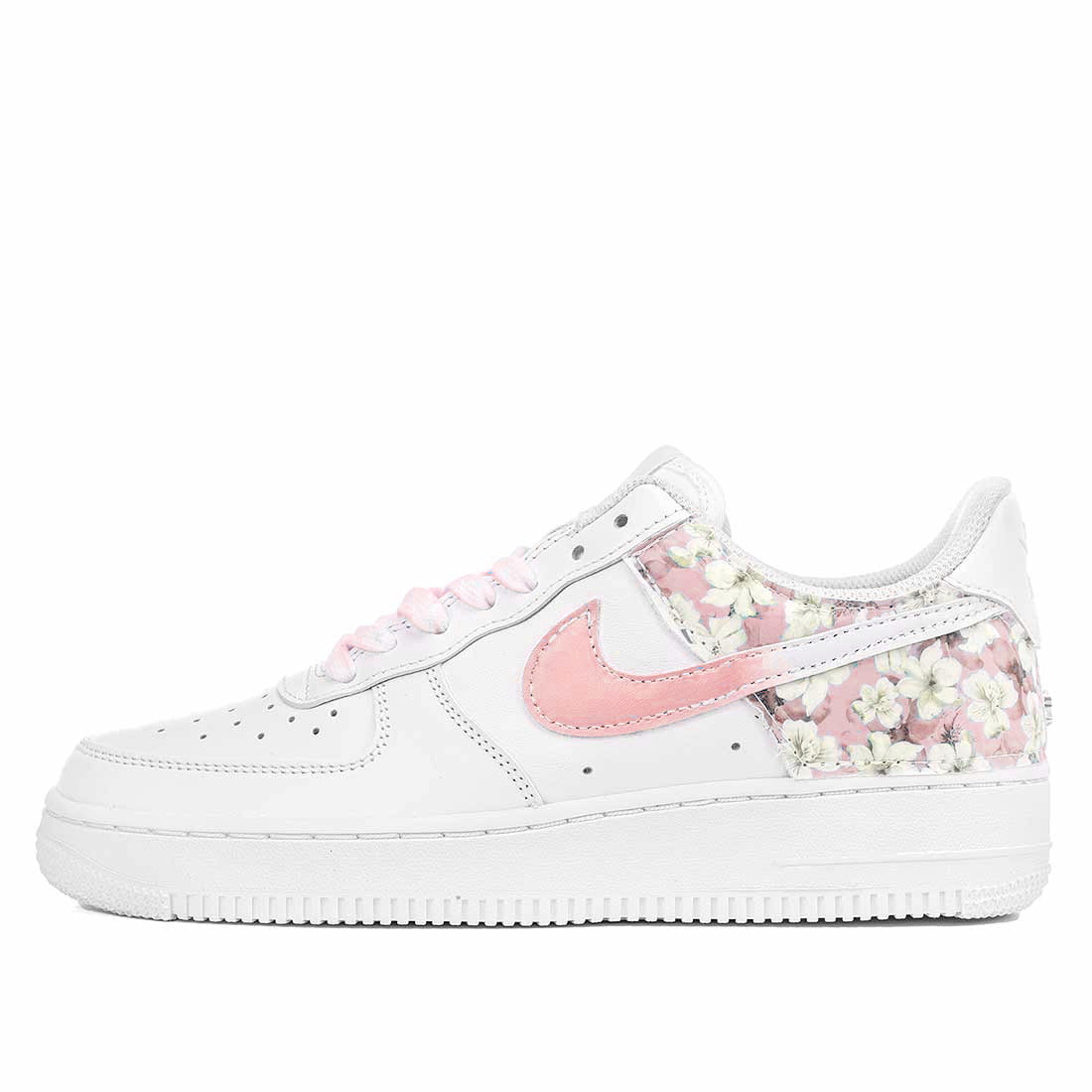 Scarpa nike con trama floreale rosa e lacci rosa