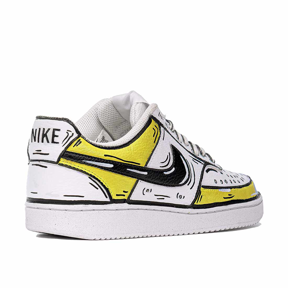 Nike gialle e bianche con effetto cartoon