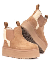 Stivaletti invernali UGG con teddy bianco e platform 