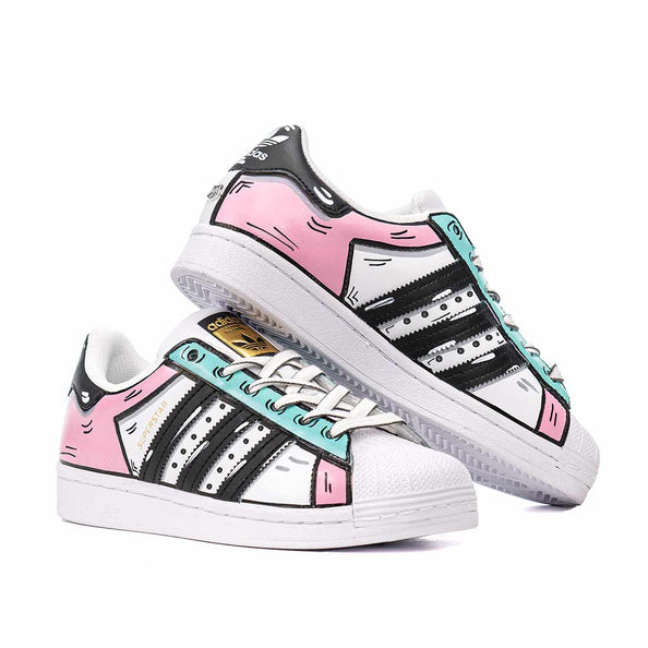 adidas disegnate rosa e azzurre effetto cartoon