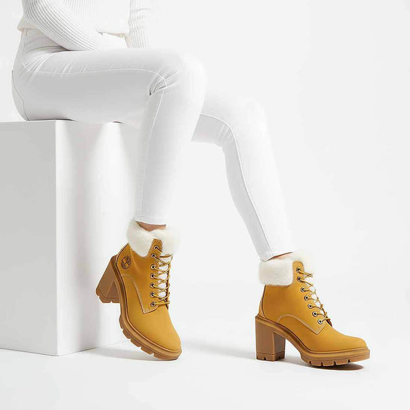 timberland con tacco e morbido pelo bianco invernale