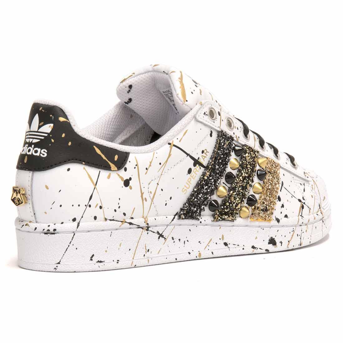 Adidas superstar nere con strisce oro Clearance