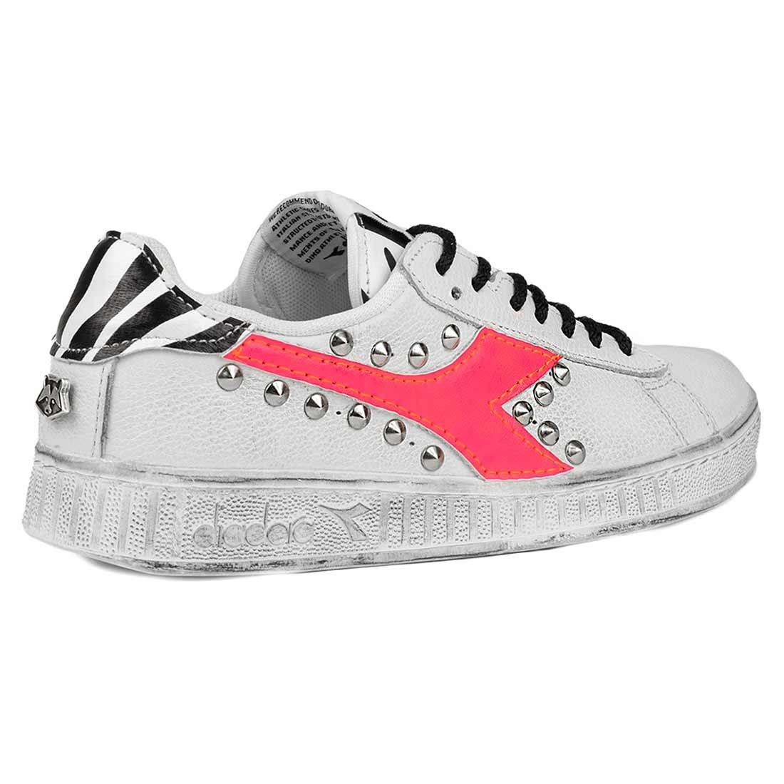 custom sneakers diadora colore rosa fosforescente fluo borchie ed inserti zebra