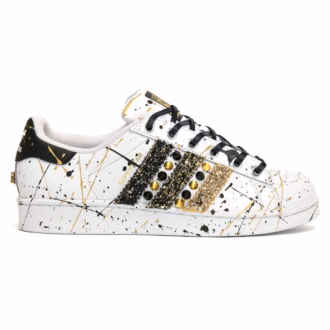 scarpe adidas superstar personalizzate con schizzi oro e nere