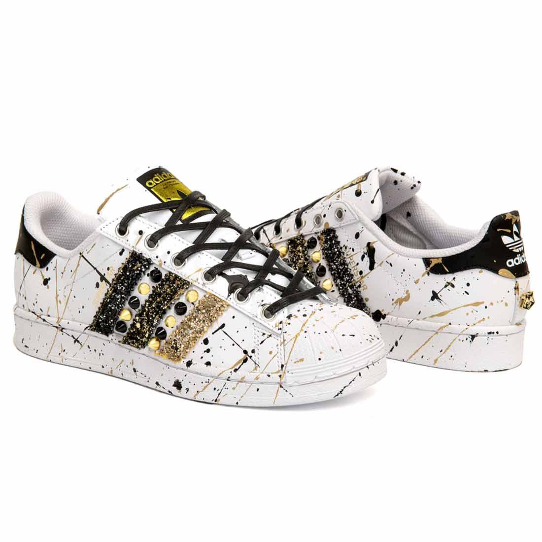 Adidas superstar nere con strisce oro Clearance